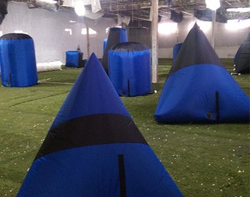 American Paintball Coliseum indoor paintball field with bunkers and paintballs